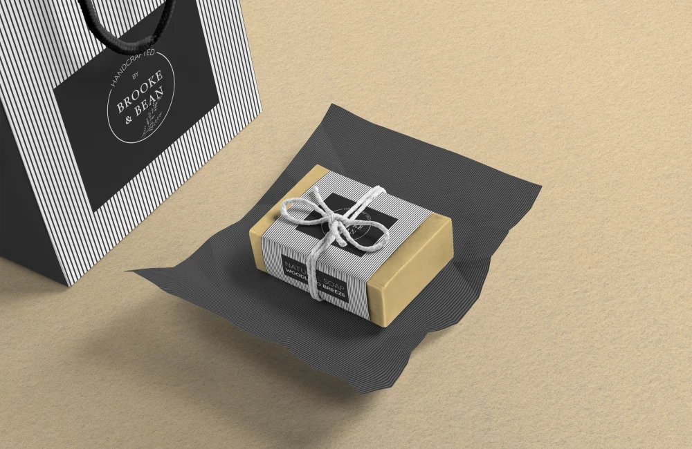 Elegant product and packaging design for Brooke & Bean, featuring coordinated striped wrapping, a custom tag, and a branded gift bag. A refined example of cohesive visual identity and high-end brand presentation by Bean Creative Marketing.