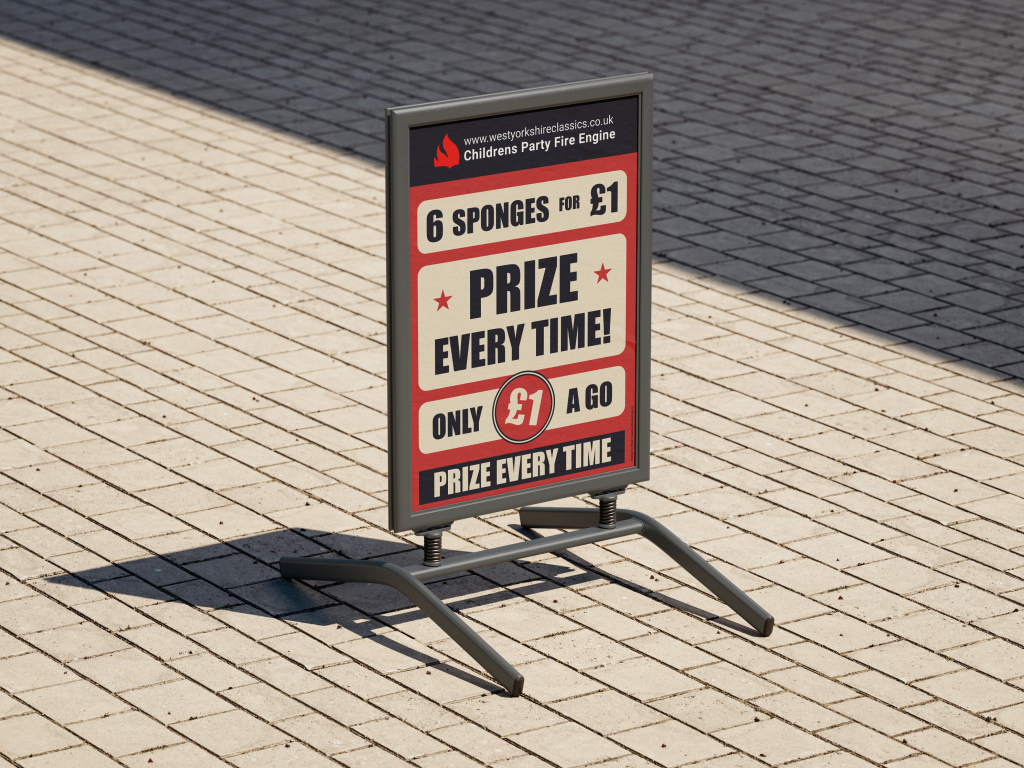 Freestanding pavement sign on stone tiles displaying a bold promotional design for a children's fire engine party game. Features vibrant branding and clear pricing — an example of high-impact outdoor signage for events or small businesses.
